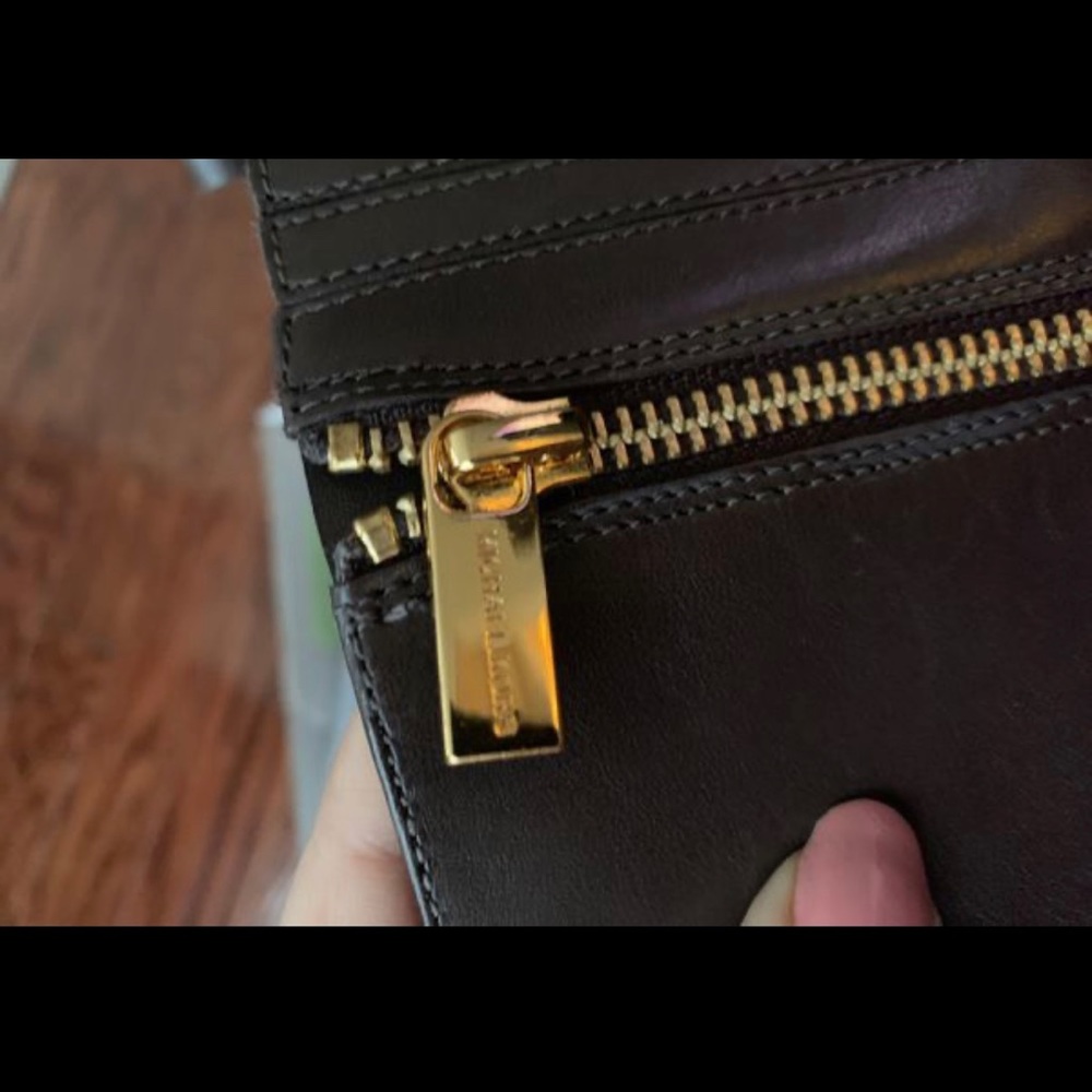 Brand new Michael Kors boots in brown. Size 8.5